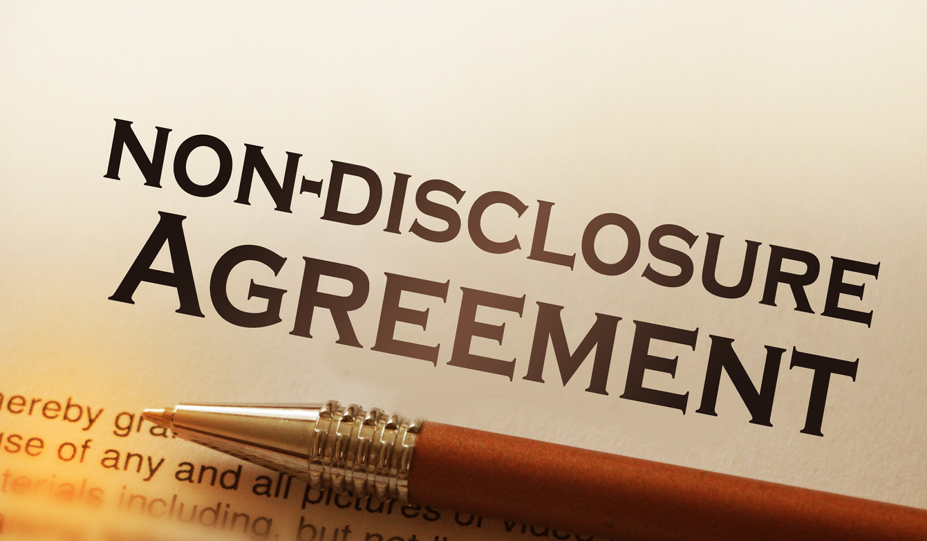Non disclosure agreement document with pen close-up
