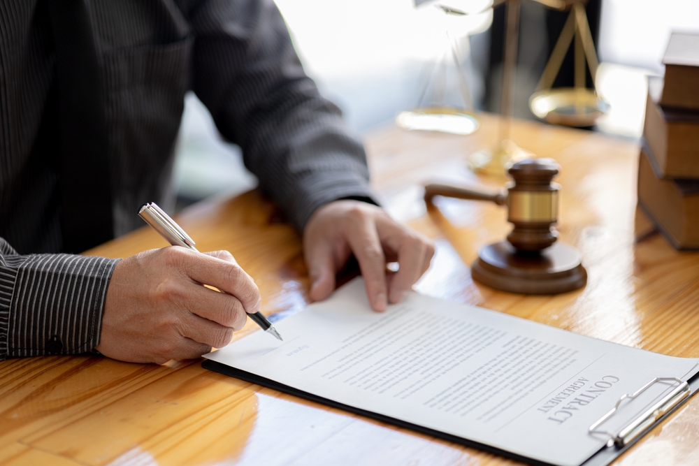 Attorneys,Are,Reviewing,Contract,Documents,For,The,Client,,In,Which