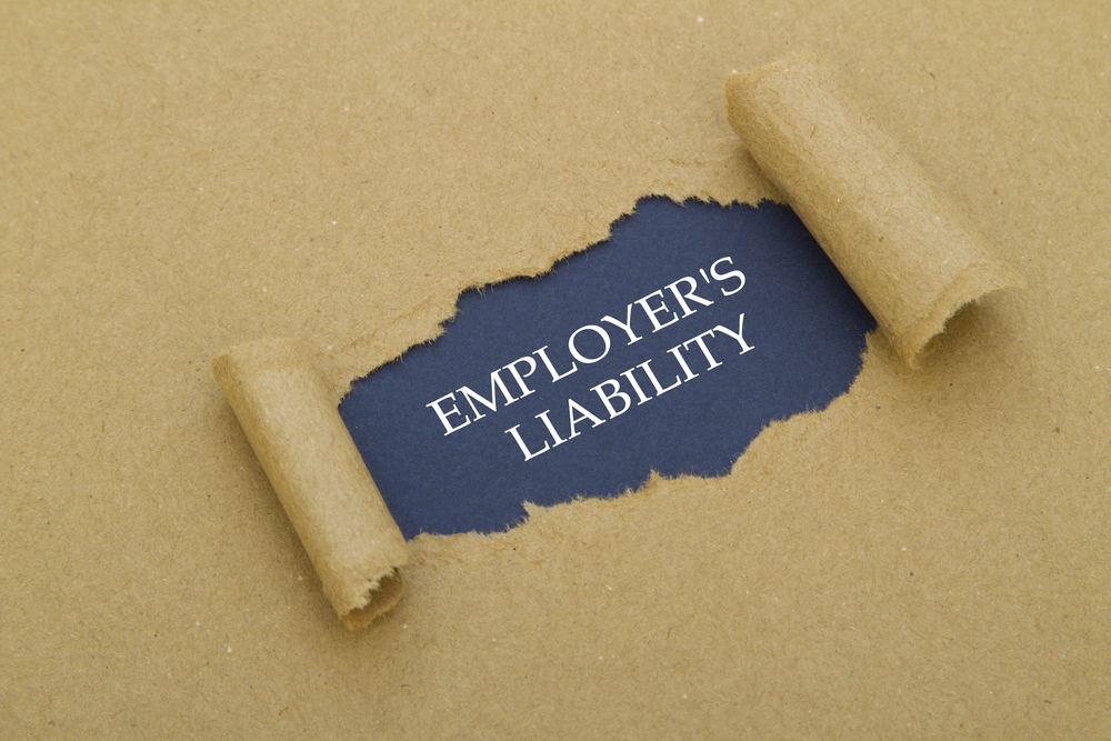 Employer's,Liability,Written,Under,Torn,Paper.